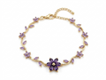 Gold-plated floral amethyst bracelet displayed on white background showing clasp and stones