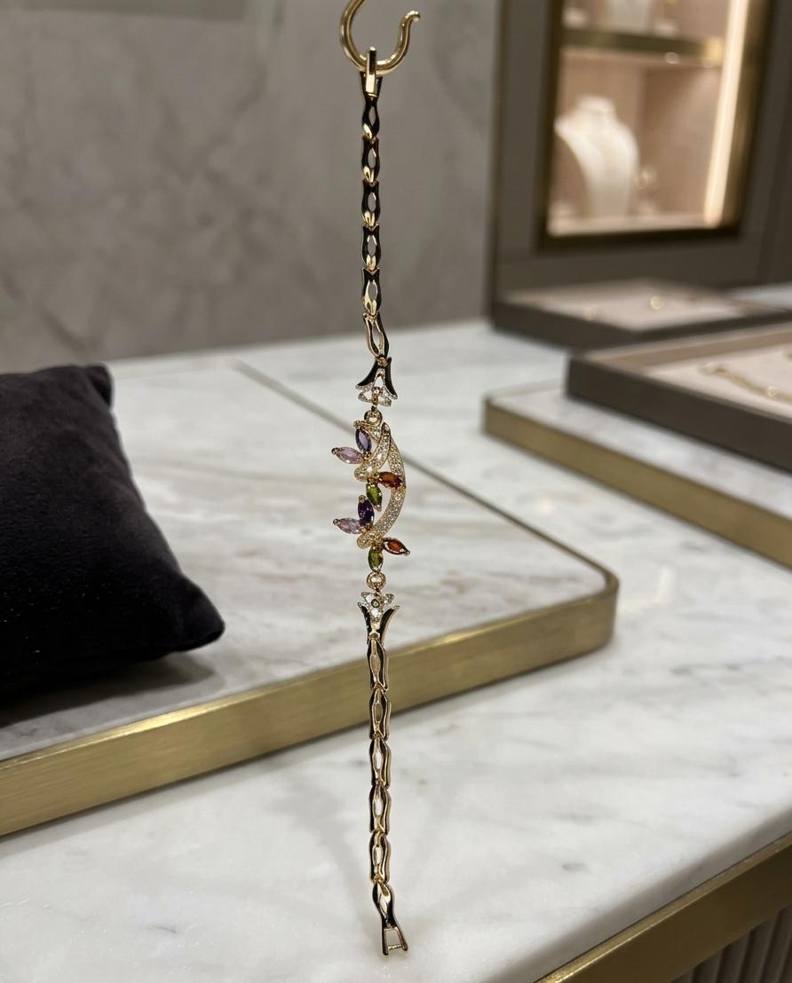 Gold plated bracelet hanging in jewelry store display